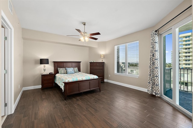 bedroom with ceiling fan, access to exterior, dark hardwood / wood-style flooring, and multiple windows