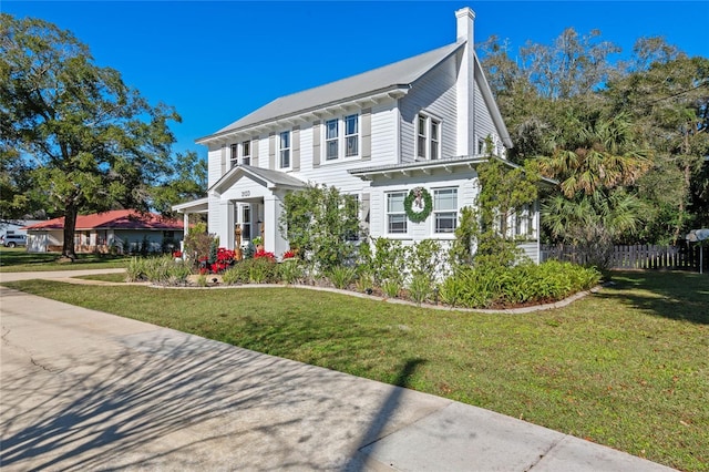 view of front of home with a front lawn