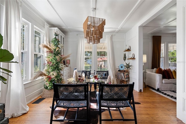 dining area featuring a wealth of natural light and light wood-type flooring