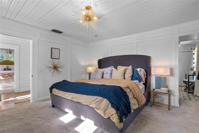 bedroom featuring light carpet