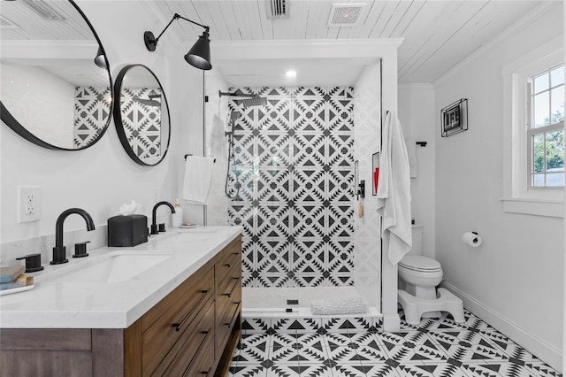 bathroom featuring tiled shower, vanity, tile patterned flooring, and wooden ceiling