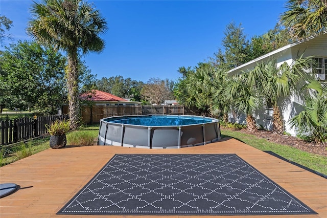 view of swimming pool featuring a wooden deck