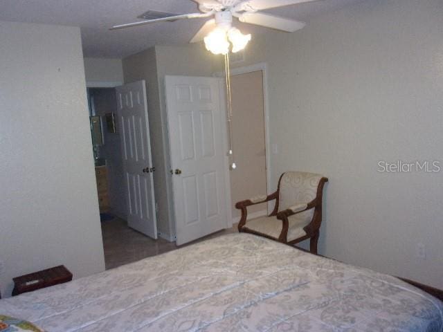 bedroom featuring ceiling fan