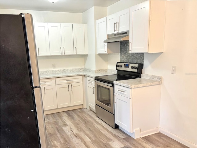 kitchen with stainless steel appliances, white cabinetry, light wood-type flooring, and light stone countertops