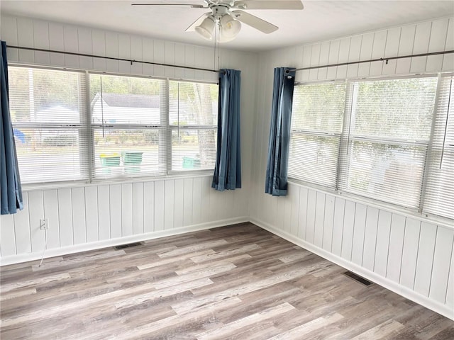 unfurnished room featuring ceiling fan and light hardwood / wood-style flooring