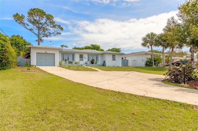 ranch-style home with a garage and a front lawn