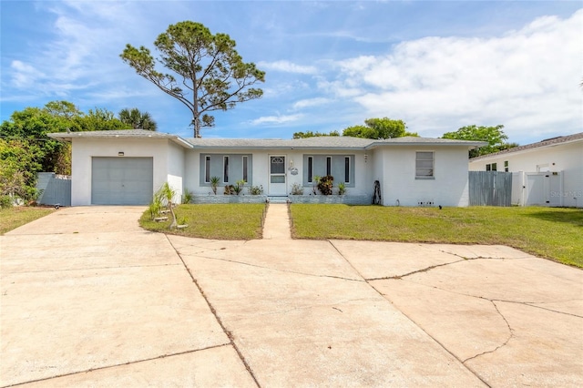 single story home featuring a garage and a front lawn