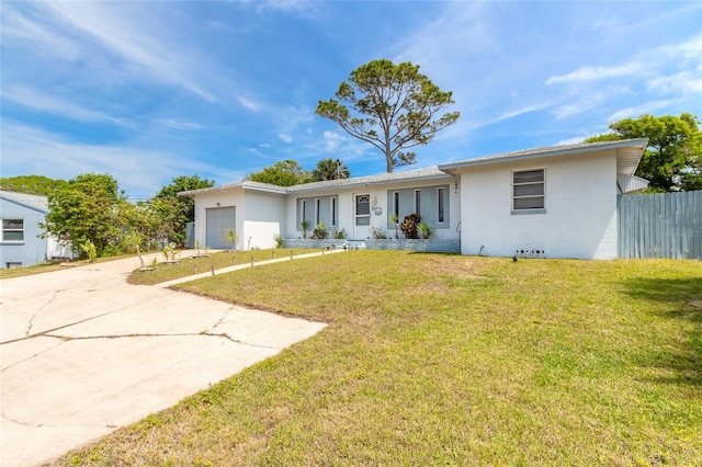 ranch-style house with a front lawn and a garage