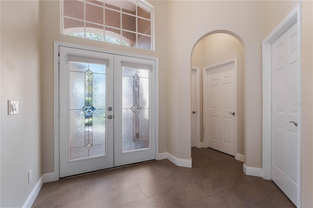 entryway with french doors and tile patterned flooring