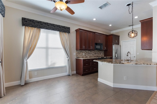 kitchen with stainless steel refrigerator with ice dispenser, a healthy amount of sunlight, backsplash, light stone countertops, and sink