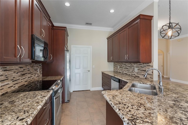 kitchen with appliances with stainless steel finishes, decorative backsplash, decorative light fixtures, light stone countertops, and sink