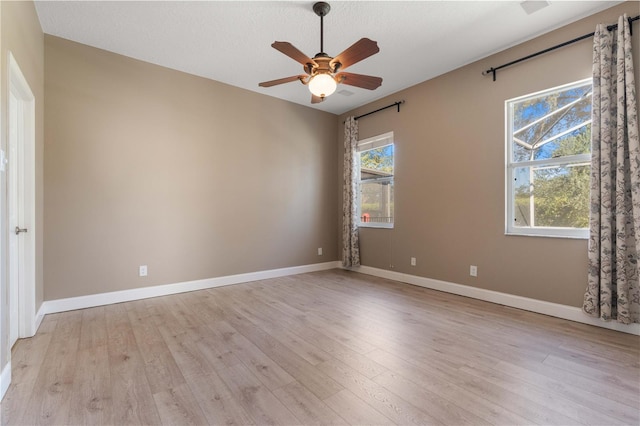 spare room featuring ceiling fan and light wood-type flooring