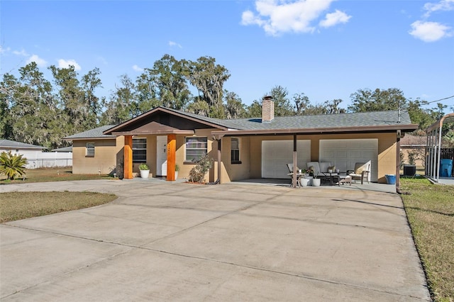 single story home featuring a garage