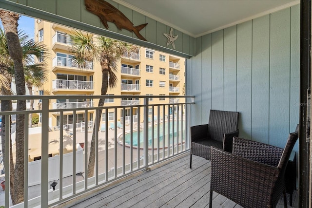 balcony featuring ceiling fan and a patio