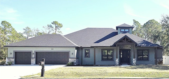 view of front of home with a garage and a front yard