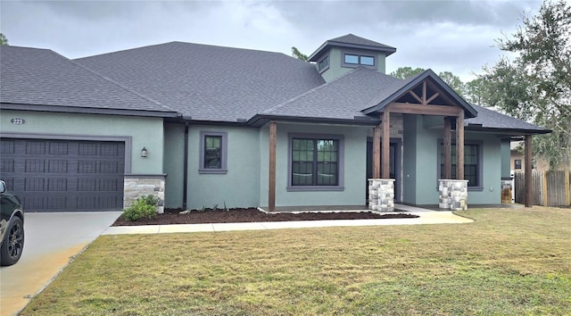 view of front facade with a front lawn and a garage