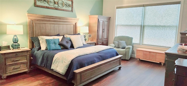 bedroom featuring dark hardwood / wood-style flooring