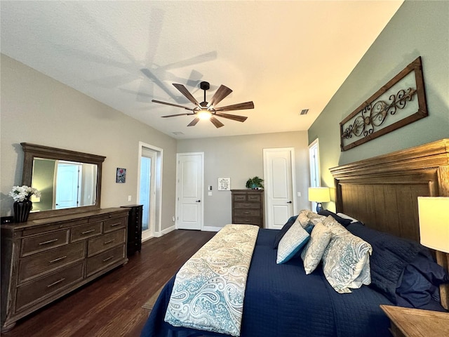 bedroom with dark wood-type flooring and ceiling fan