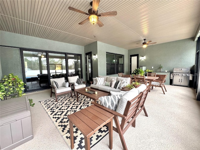 exterior space with ceiling fan, an outdoor hangout area, area for grilling, and an outdoor kitchen