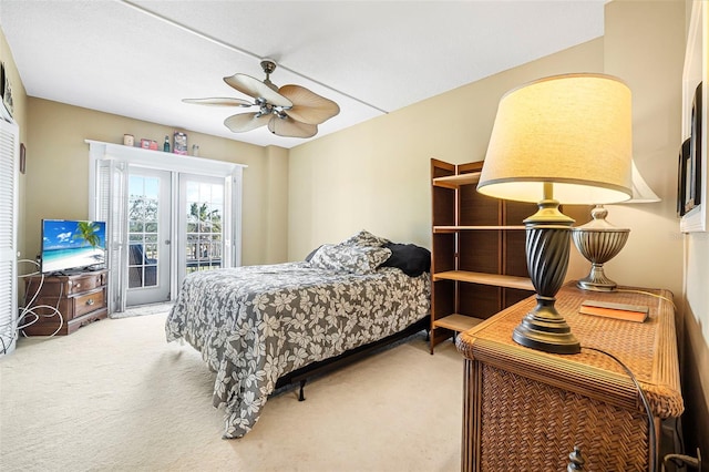 carpeted bedroom with ceiling fan and access to outside