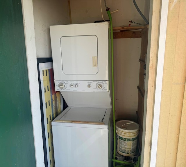 laundry room with stacked washer and dryer