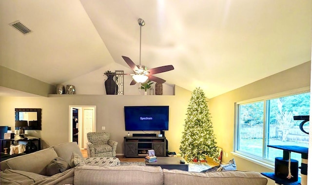 living room featuring vaulted ceiling, ceiling fan, and wood-type flooring