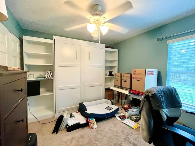 bedroom featuring ceiling fan and light colored carpet