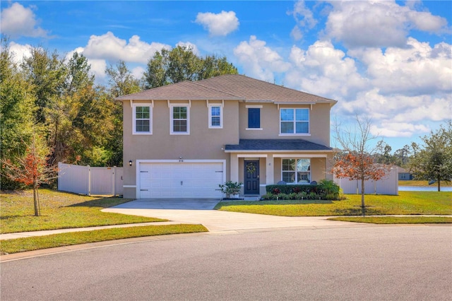 front of property with a front lawn and a garage