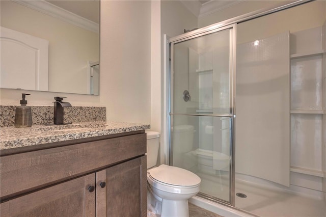 bathroom with toilet, walk in shower, crown molding, and vanity