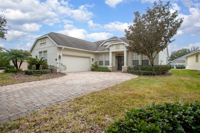 view of front of house featuring a front yard and a garage