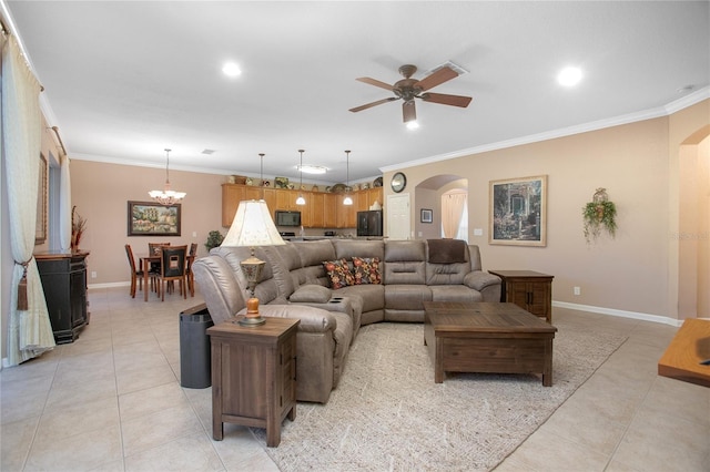 tiled living room with ceiling fan with notable chandelier and ornamental molding