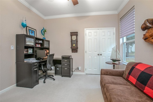 home office with ceiling fan, light colored carpet, and ornamental molding