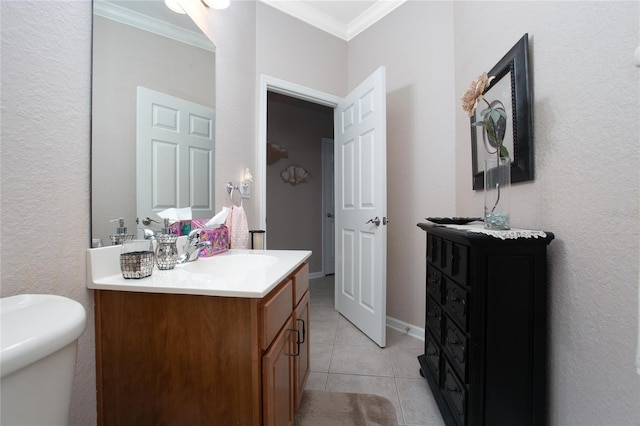 bathroom with toilet, tile patterned flooring, crown molding, and vanity