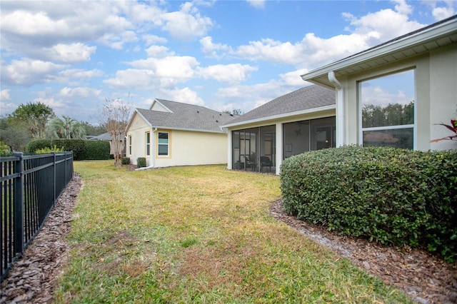 view of yard with a sunroom