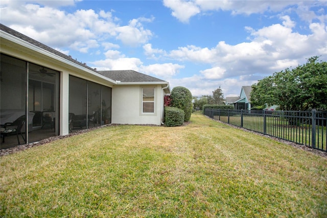 view of yard featuring a sunroom