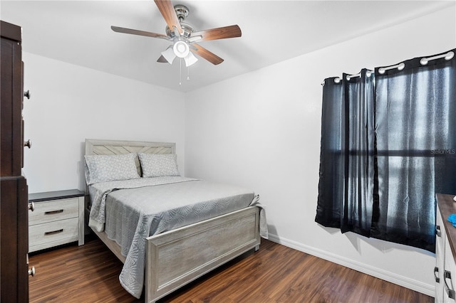 bedroom featuring dark wood-type flooring and ceiling fan