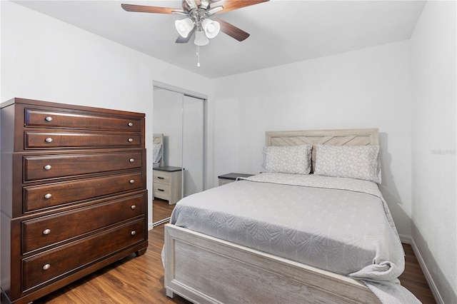 bedroom featuring ceiling fan, a closet, and light hardwood / wood-style flooring