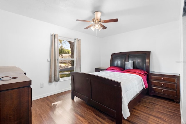 bedroom with ceiling fan and dark hardwood / wood-style flooring