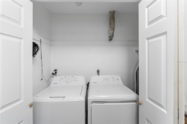 laundry area with independent washer and dryer