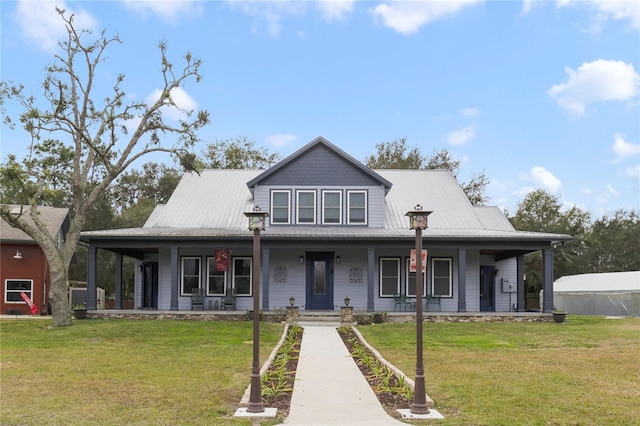 farmhouse inspired home featuring a front lawn and a porch