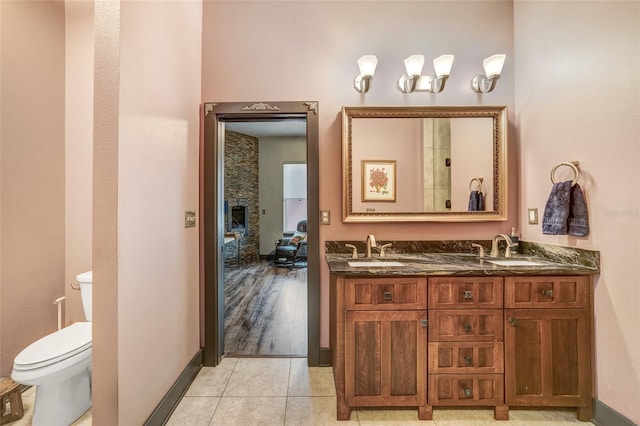 bathroom with tile patterned floors, vanity, and toilet