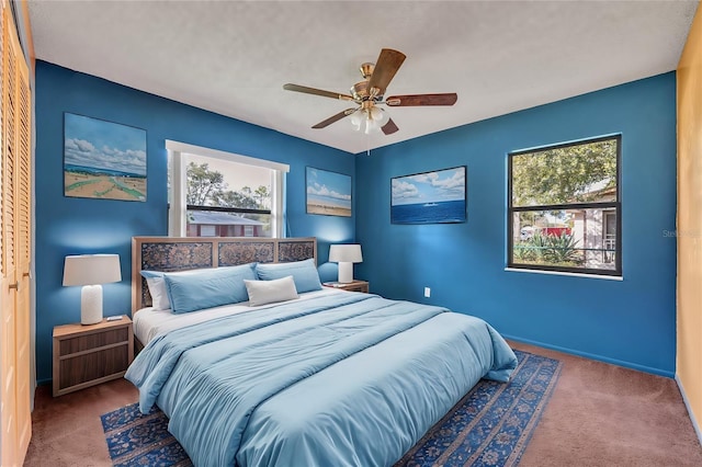 bedroom featuring ceiling fan, carpet floors, and a closet