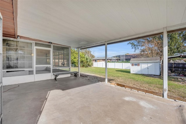 view of patio with a storage shed