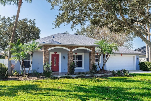 ranch-style home featuring a garage and a front yard