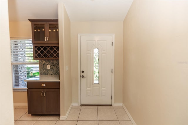 tiled entrance foyer with bar