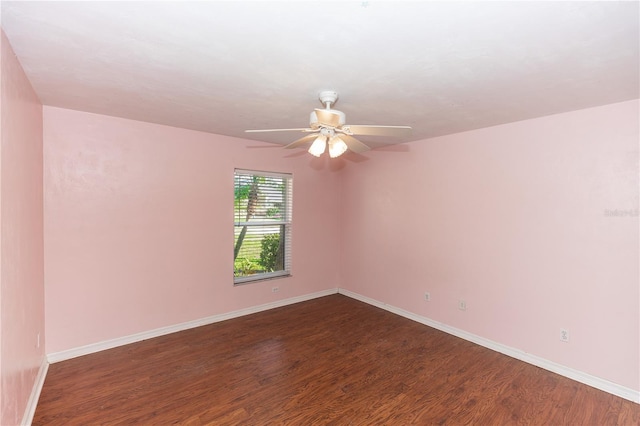 empty room featuring dark hardwood / wood-style floors and ceiling fan