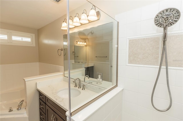 bathroom featuring independent shower and bath and vanity