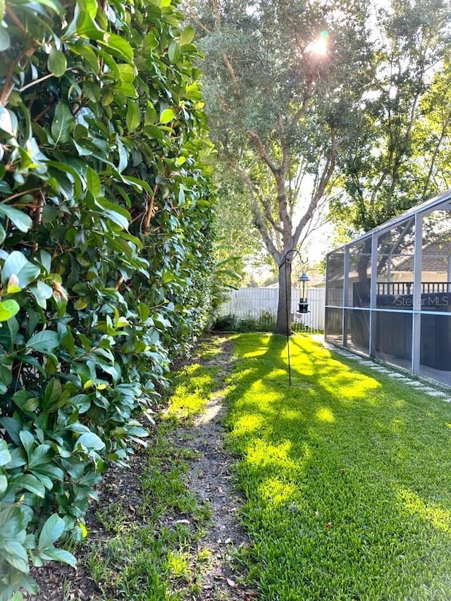 view of yard with a lanai