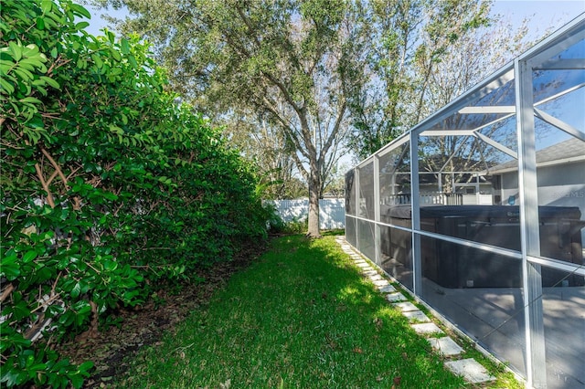 view of yard featuring a lanai