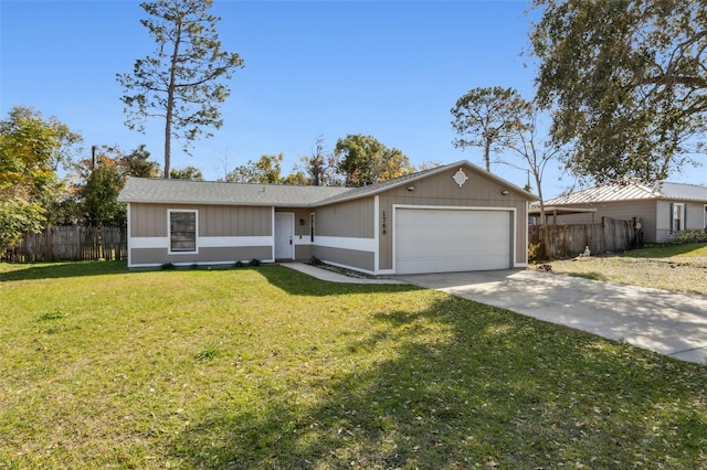 ranch-style home with a garage and a front lawn